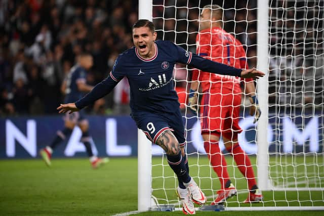 Paris Saint-Germain's Argentinian forward Mauro Icardi celebrates scoring his team's second goal during the French L1 football match between Paris-Saint Germain (PSG) and Olympique Lyonnais at The Parc des Princes Stadium in Paris on September 19, 2021