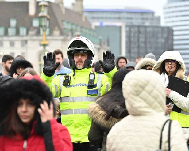 Pedestrians evacuate Westminster Bridge in London following a security alert. Photo: AFP/Getty