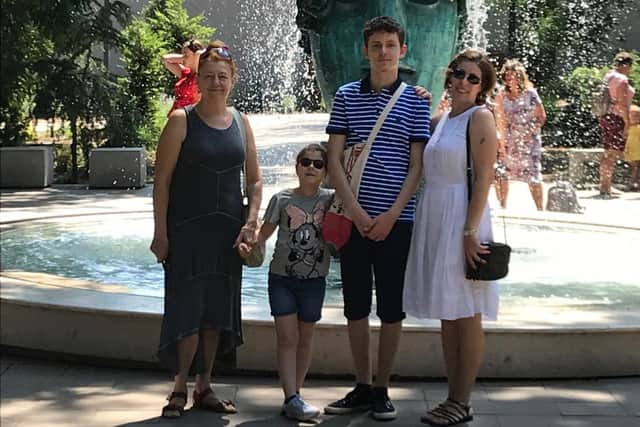 Tatiana, left, with two of her grandchildren, and daughter Natalia. Photo: Supplied