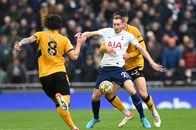 Dejan Kulusevski of Tottenham Hotspur is challenged by Max Kilman of Wolverhamton (Photo by Shaun Botterill/Getty Images)