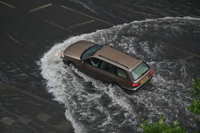 Flood in Nine Elms last summer. Credit: (Photo by JUSTIN TALLIS/AFP via Getty Images)