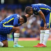 Cesar Azpilicueta of Chelsea interacts with Reece James of Chelsea who is down injured (Photo by Catherine Ivill/Getty Images)