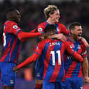  Conor Gallagher celebrates with teammates Christian Benteke and Wilfried Zaha (Photo by Tom Dulat/Getty Images)