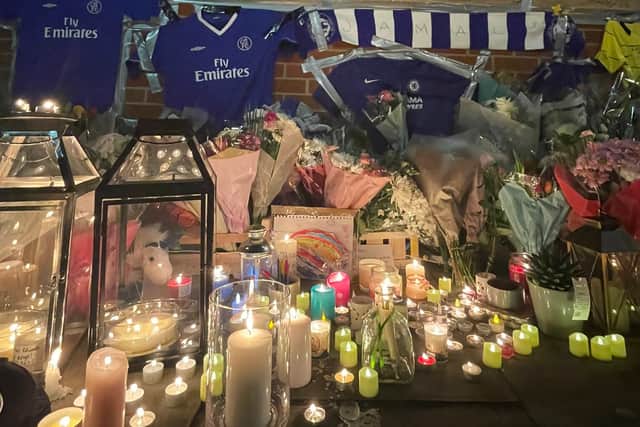 Candles and Chelsea shirts laid out for Jamal Edwards. Credit: Acton Notebook