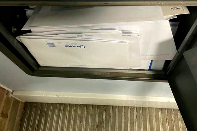 Letters piling up at the property.  The body of a skeleton has been found in a London flat - after reports of a bad smell for over two YEARS, neighbours said. Credit: SWNS
