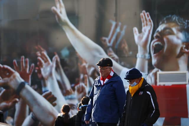 Brentford fans arrive at the stadium prior to the Premier League match (Photo by Dan Istitene/Getty Images)