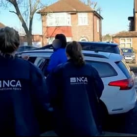 A British national wanted in Belgium for trying to help smuggle a boat of refugees across the Channel to the UK has been arrested in London. Credit: NCA / SWNS