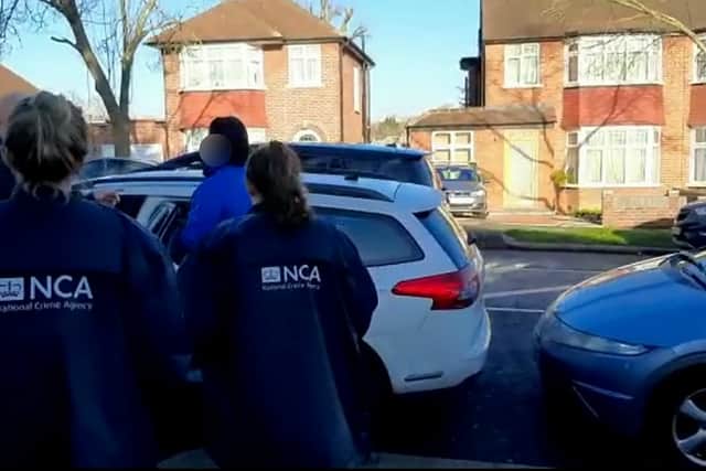 A British national wanted in Belgium for trying to help smuggle a boat of refugees across the Channel to the UK has been arrested in London. Credit: NCA / SWNS