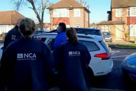 A British national wanted in Belgium for trying to help smuggle a boat of refugees across the Channel to the UK has been arrested in London. Credit: NCA / SWNS