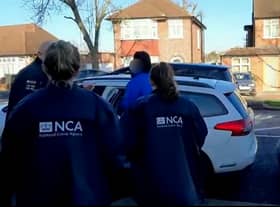 A British national wanted in Belgium for trying to help smuggle a boat of refugees across the Channel to the UK has been arrested in London. Credit: NCA / SWNS