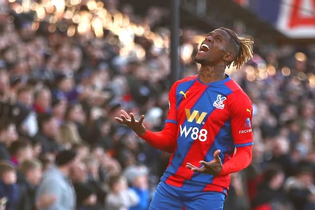 Wilfried Zaha of Crystal Palace reacts during the Premier League match  (Photo by Christopher Lee/Getty Images)
