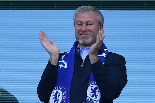 Chelsea’s Russian owner Roman Abramovich applauds, as players  (Photo credit should read BEN STANSALL/AFP via Getty Images)
