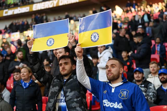 Chelsea fans hold banners in support of Ukraine to indicate peace and sympathy (Photo by Michael Regan/Getty Images)