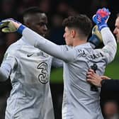 Chelsea's German head coach Thomas Tuchel (R) substitutes Chelsea's French-born Senegalese goalkeeper Edouard Mendy (L) for Chelsea's Spanish goalkeeper Kepa Arrizabalaga 