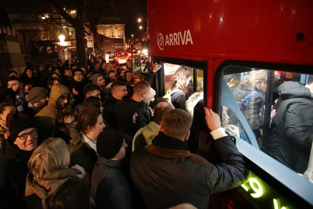 Swarms of people try and get on a bus during the last big Tube strikes in 2017. TfL have advised Londoners to use alternative modes of transport on Tuesday and Thursday this week. Credit: DANIEL LEAL/AFP via Getty Images