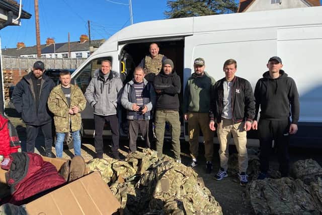 A group of volunteers delivering military supplies to the frontline