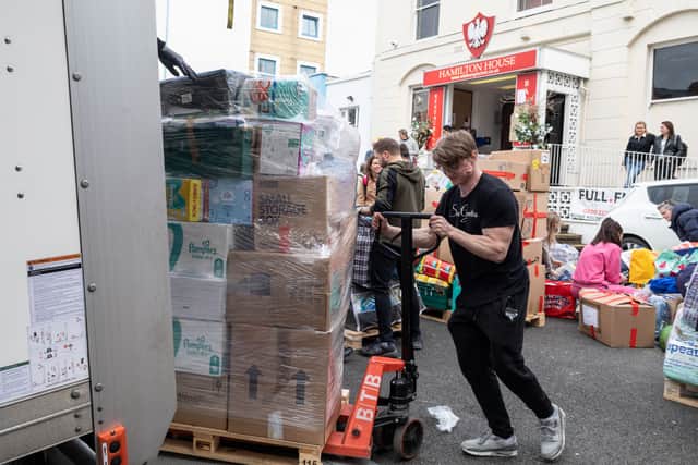 A palette of donations is loaded up onto the lorry taking it to Ukraine, from The White Eagle Club, Balham. Credit: SWNS