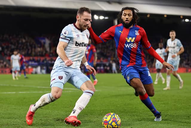 Vladimir Coufal of West Ham United is challenged by Jairo Riedewald of Crystal Palace (Photo by Marc Atkins/Getty Images)