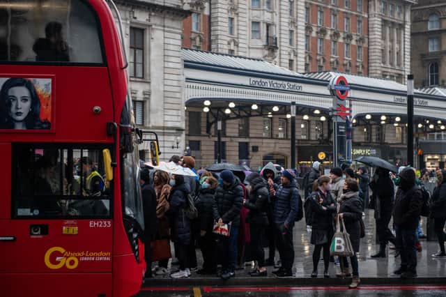 Commuters wait in long queues for buses at Victoria Train station as the underground is shut down due to strikes. Credit: Chris J Ratcliffe/Getty Images