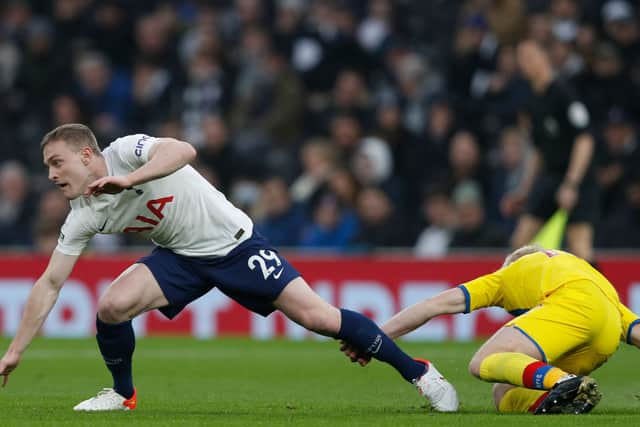  Oliver Skipp (L) vies with Crystal Palace’s English midfielder Will Hughes (R) d (Photo by ADRIAN DENNIS/AFP via Getty Images)