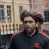 Cops have released a picture of a man after a collection box for Ukraine containing about £100 was swiped from a cafe in east London. Credit: Metropolitan Police / SWNS