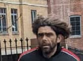 Cops have released a picture of a man after a collection box for Ukraine containing about £100 was swiped from a cafe in east London. Credit: Metropolitan Police / SWNS