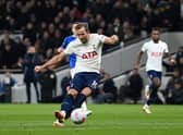 Harry Kane of Tottenham Hotspur scores their sides third goal during the Premier League match (Photo by Shaun Botterill/Getty Images)