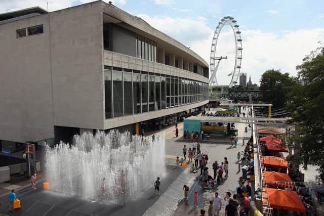 Children play in a fountain entitled 'Appearing Rooms' by artist Jeppe Hein at the Southbank Centre