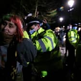 A woman is arrested during a vigil for Sarah Everard on Clapham Common. Credit: Hollie Adams/Getty Images