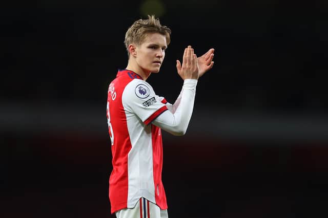 Martin Odegaard of Arsenal celebrates victory following the Premier League match (Photo by Catherine Ivill/Getty Images)