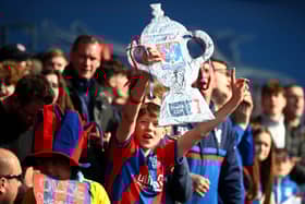 Crystal Palace fans celebrate with a tin foil FA Cup during the Emirates FA Cup  (Photo by Christopher Lee/Getty Images)