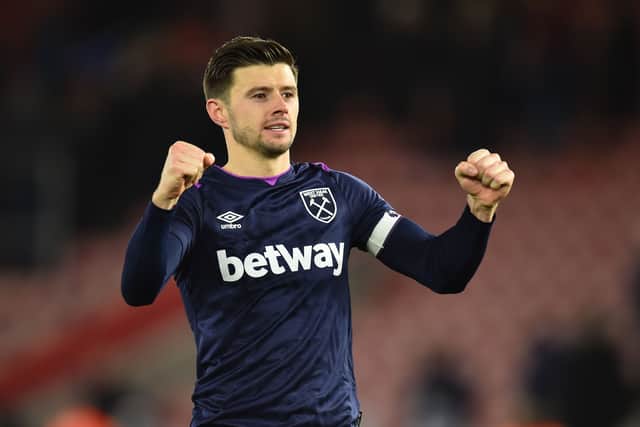 West Ham United’s English defender Aaron Cresswell celebrates on the pitch after the English Premier League football match (Photo by GLYN KIRK/AFP via Getty Images)