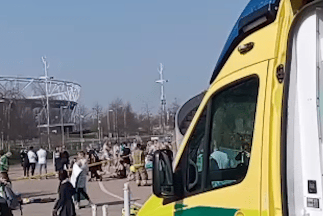 People being treated by paramedics outside the London Aquatics Centre. Credit: SWNS