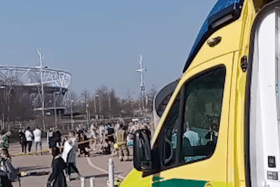 People being treated by paramedics outside the London Aquatics Centre. Credit: SWNS