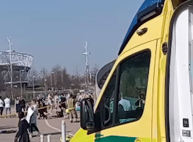 <p>People being treated by paramedics outside the London Aquatics Centre. Credit: SWNS</p>