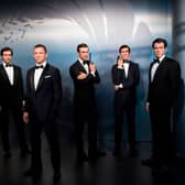 Wax figures of James Bond actors (L-R) Roger Moore, Timothy Dalton, Daniel Craig, Sean Connery, George Lazenby and Pierce Brosnan at Madame Tussauds (Photo: STEFFI LOOS/AFP via Getty Images)