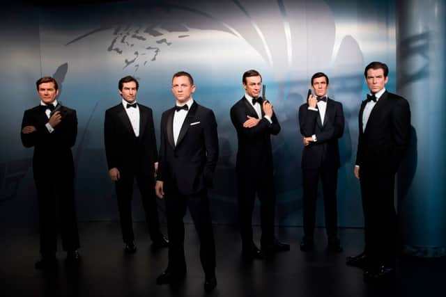 Wax figures of James Bond actors (L-R) Roger Moore, Timothy Dalton, Daniel Craig, Sean Connery, George Lazenby and Pierce Brosnan at Madame Tussauds (Photo: STEFFI LOOS/AFP via Getty Images)