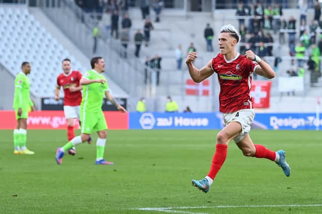 Nico Schlotterbeck of SC Freiburg celebrates after scoring his team`s third goal during the Bundesliga match between Sport-Club Freiburg and VfL Wolfsburg. Credit: Christian Kaspar-Bartke/Getty Images
