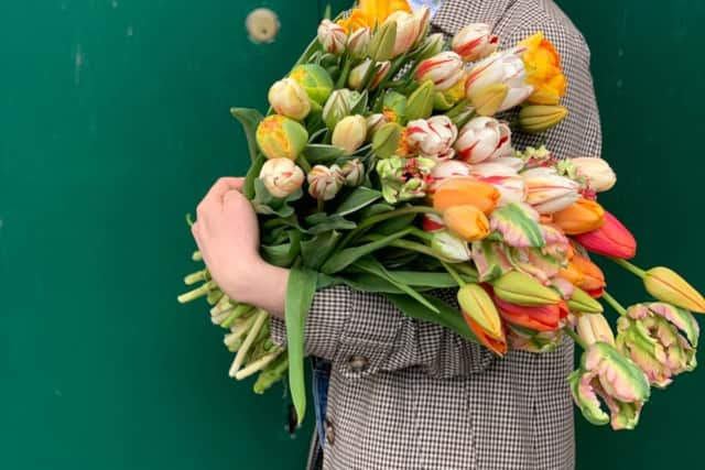 Lucy with tulips. Credit: Lucy Vail