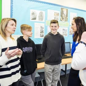 (Left to right) Mum Oksana Kyrychenko, Roman Kyrychenko, 12, Vlad Kyrychenko, 14, deputy head Amy Brown and history teacher Nicholas Penn. Credit: Ben Mole / SWNS