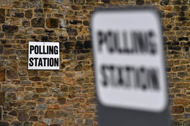 Signs outside a polling station. Photo: Getty