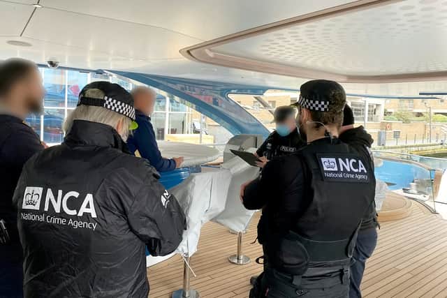 Officers from the National Crime Agency's Combating Kleptocracy Cell have this morning served a detention notice on a superyacht owned by a Russian national. Credit: NCA / SWNS