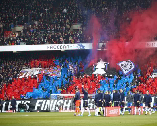 Crystal Palace fans raise a banner with an image of the FA Cup trophy  (Photo by Christopher Lee/Getty Images)