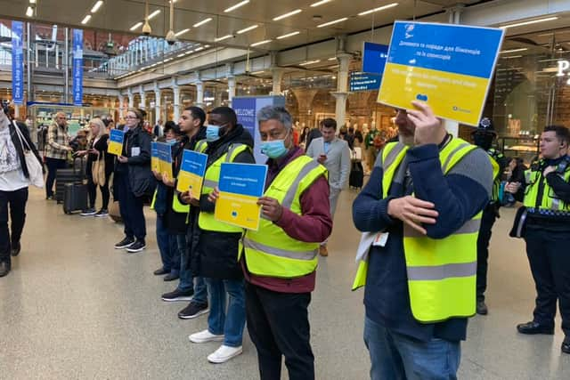 Camden volunteers greeting Ukrainian refugees off the Eurostar.