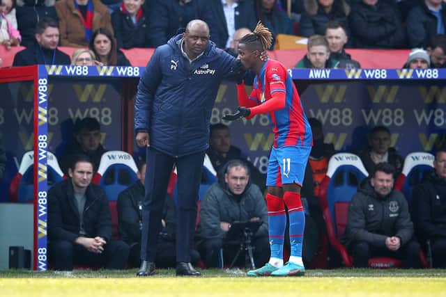 Patrick Vieira, Manager of Crystal Palace speaks with Wilfried Zaha of Crystal Palace (Photo by Christopher Lee/Getty Images)