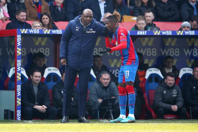 Patrick Vieira, Manager of Crystal Palace speaks with Wilfried Zaha of Crystal Palace (Photo by Christopher Lee/Getty Images)