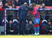 Patrick Vieira, Manager of Crystal Palace speaks with Wilfried Zaha of Crystal Palace (Photo by Christopher Lee/Getty Images)