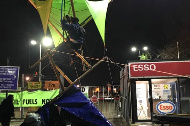 Extinction Rebellion activists at Esso West oil facility in west London at 04:00am this morning.