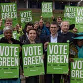 Green Party co-leaders Adrian Ramsay and Carla Denyer stand in a housing estate in Crystal Palace with party members to launch their local election campaign. Photo: Getty