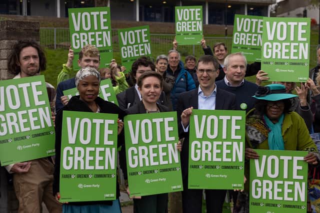 Green Party co-leaders Adrian Ramsay and Carla Denyer stand in a housing estate in Crystal Palace with party members to launch their local election campaign. Photo: Getty